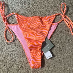 An orange and pink bathing suit bottom